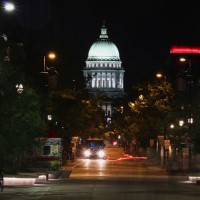 Madison bus line at night by the capital building.